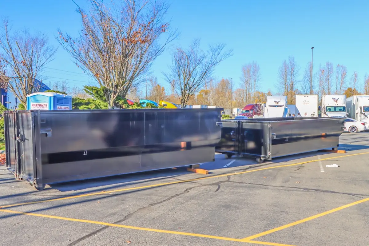 Professional dumpster rental service with roll-off container on residential driveway in Rockledge